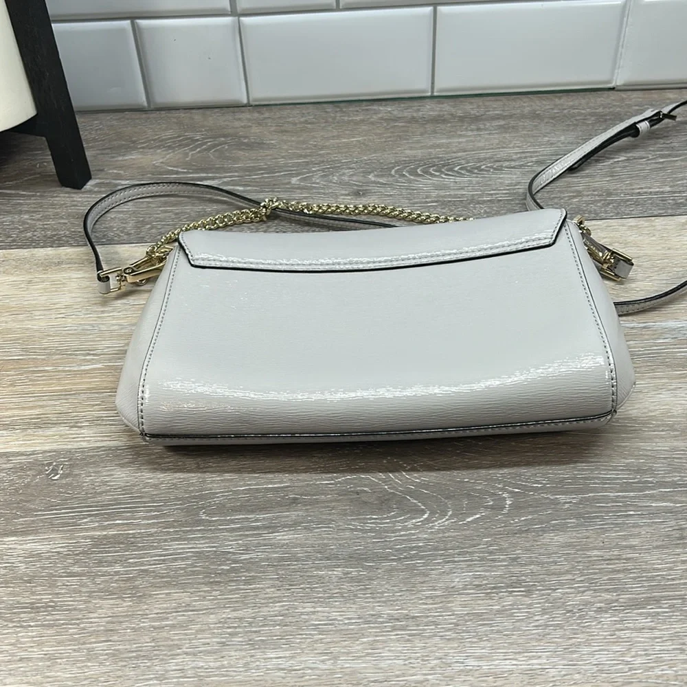 Kate Spade gray crossbody with gold chain
